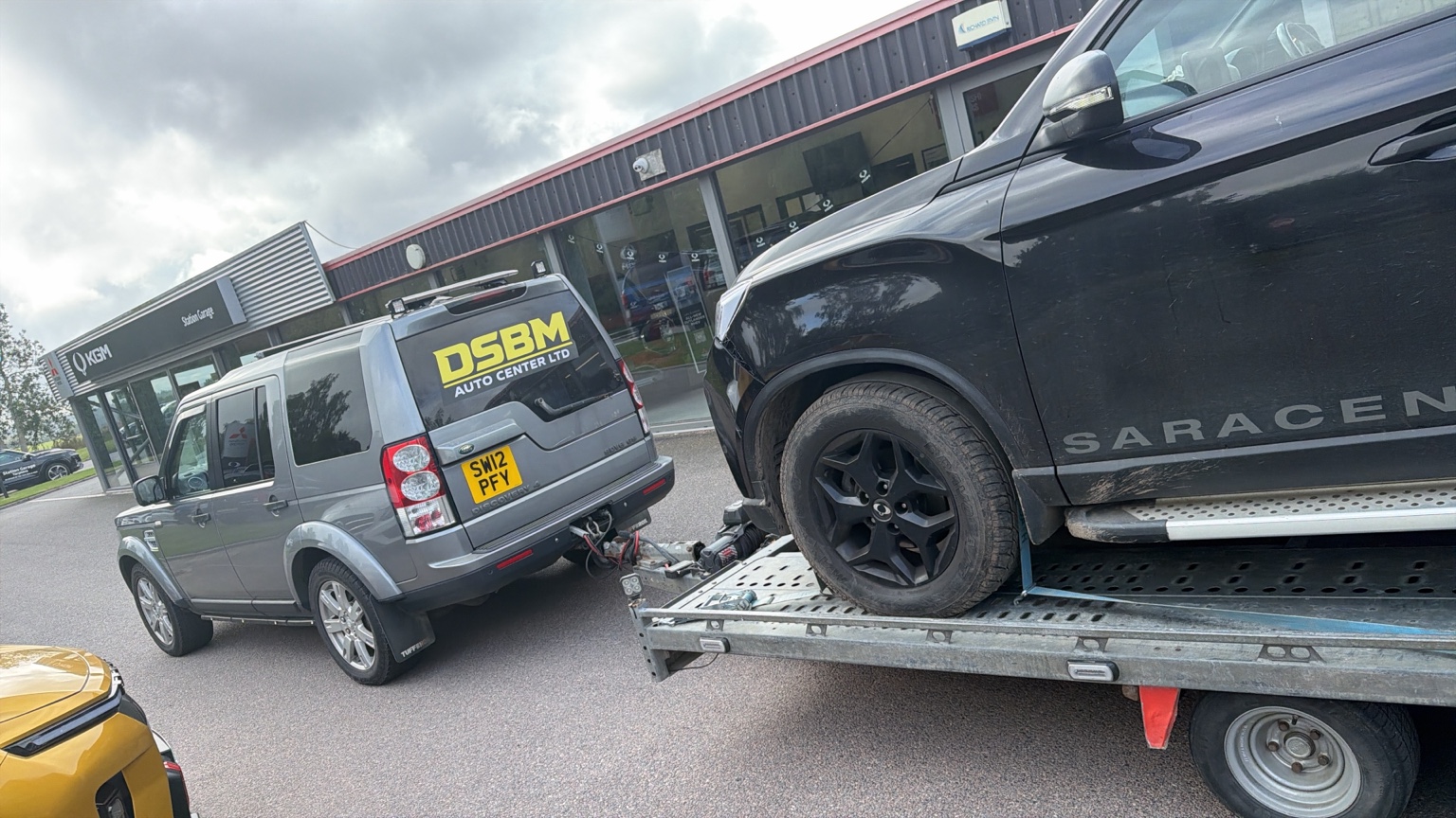 DSBM Discovery carrying a pickup on the transporter
